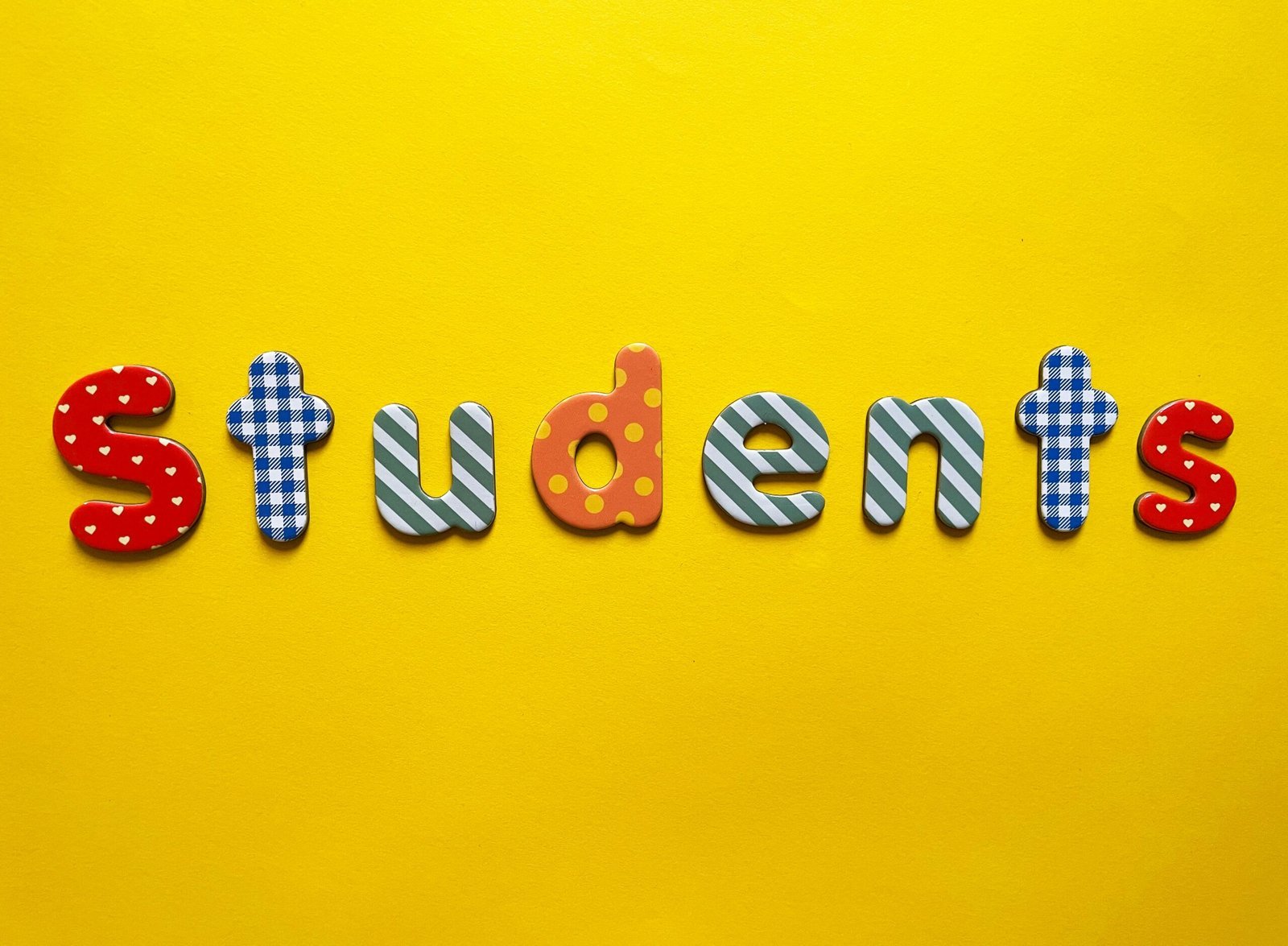 a yellow background with the word students spelled out