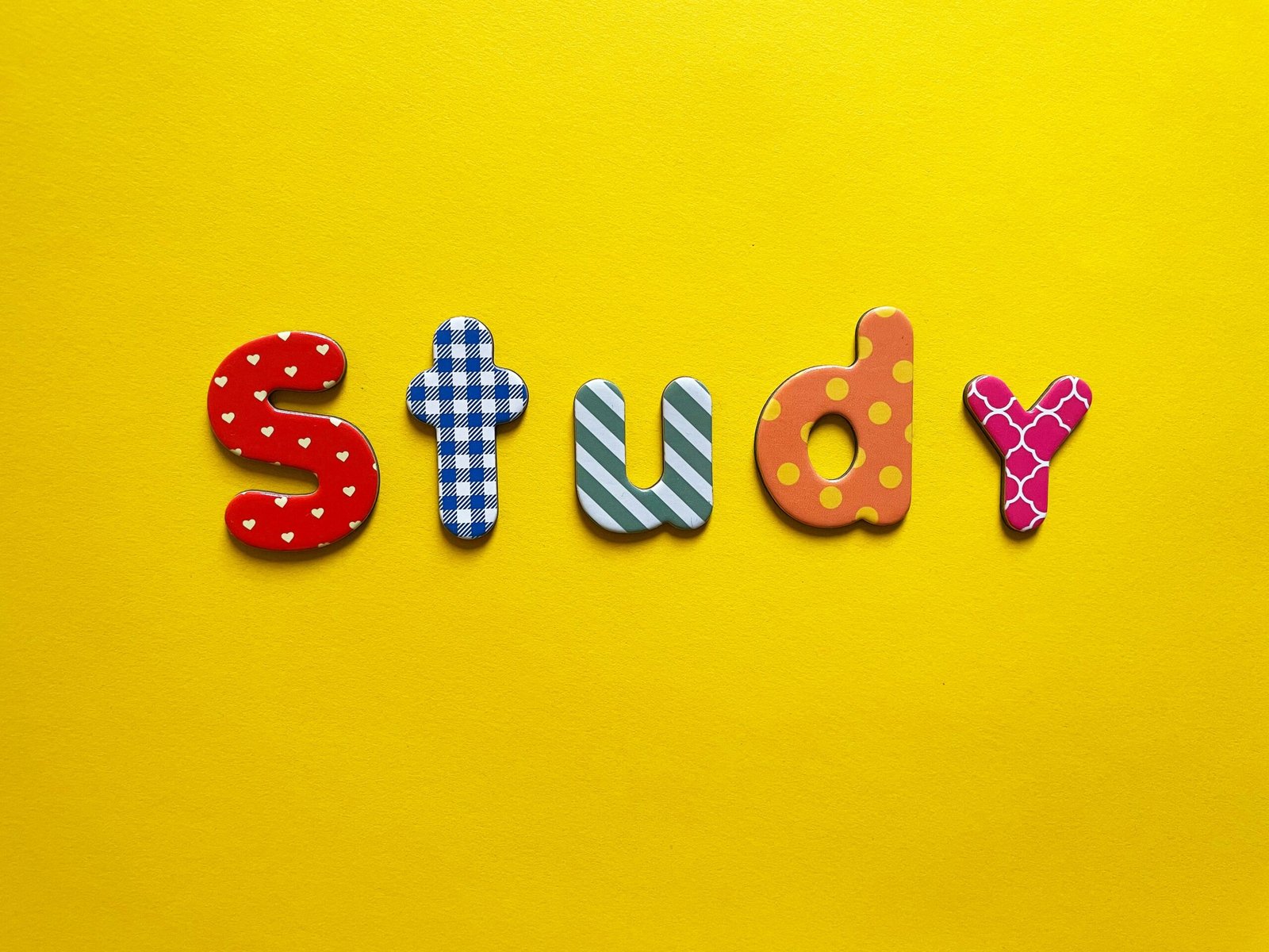 a yellow background with the word study spelled out