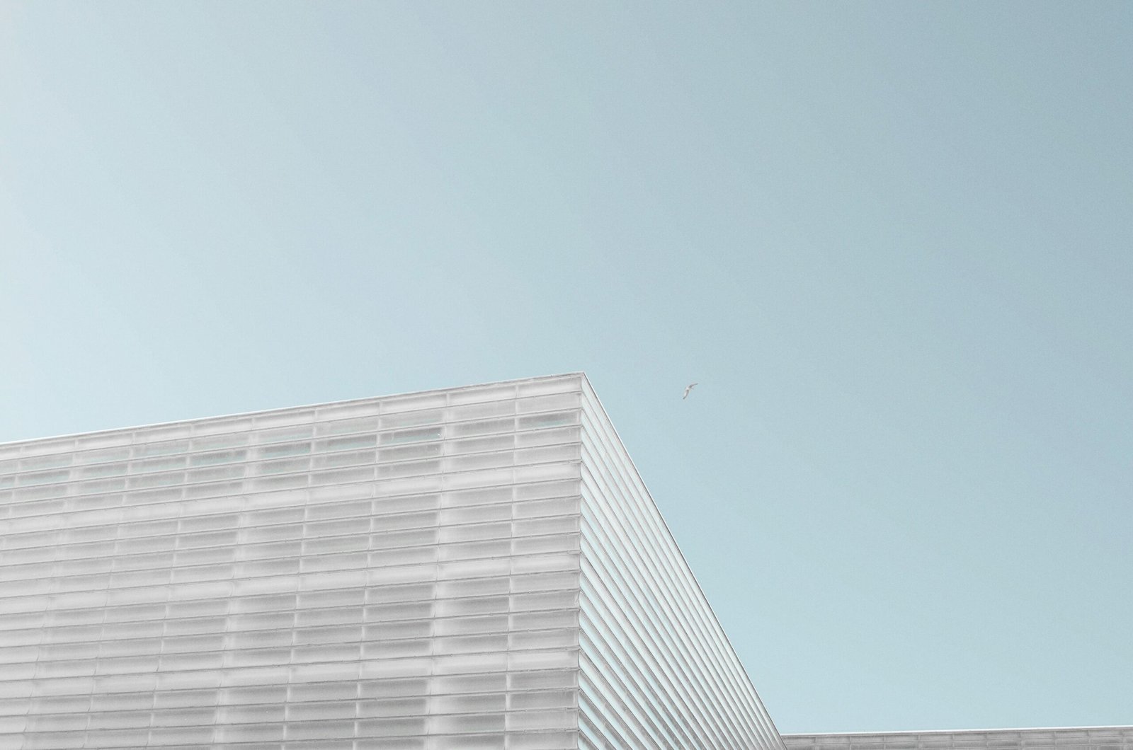 grey concrete building under clear blue sky