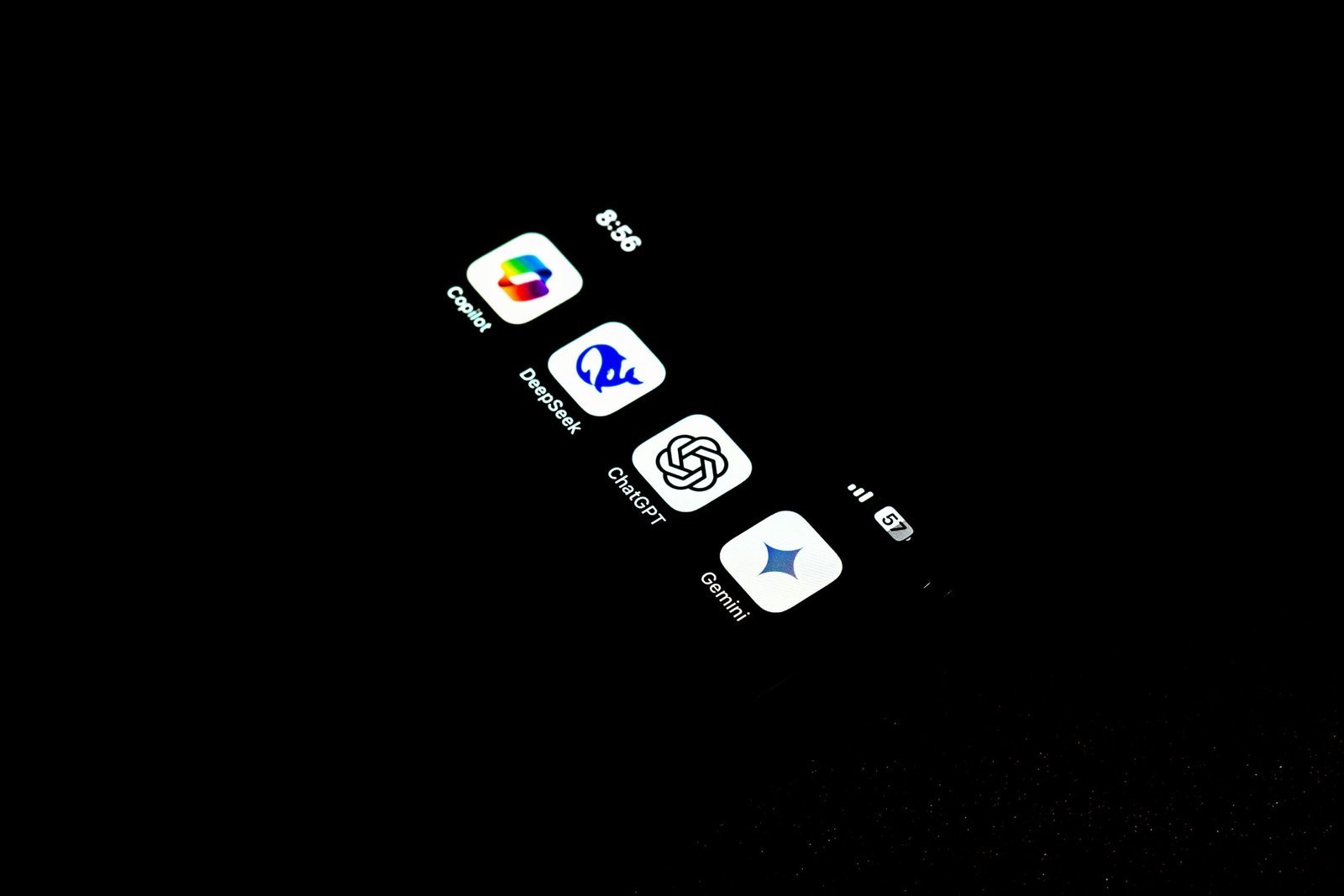 A cell phone that is lit up in the dark